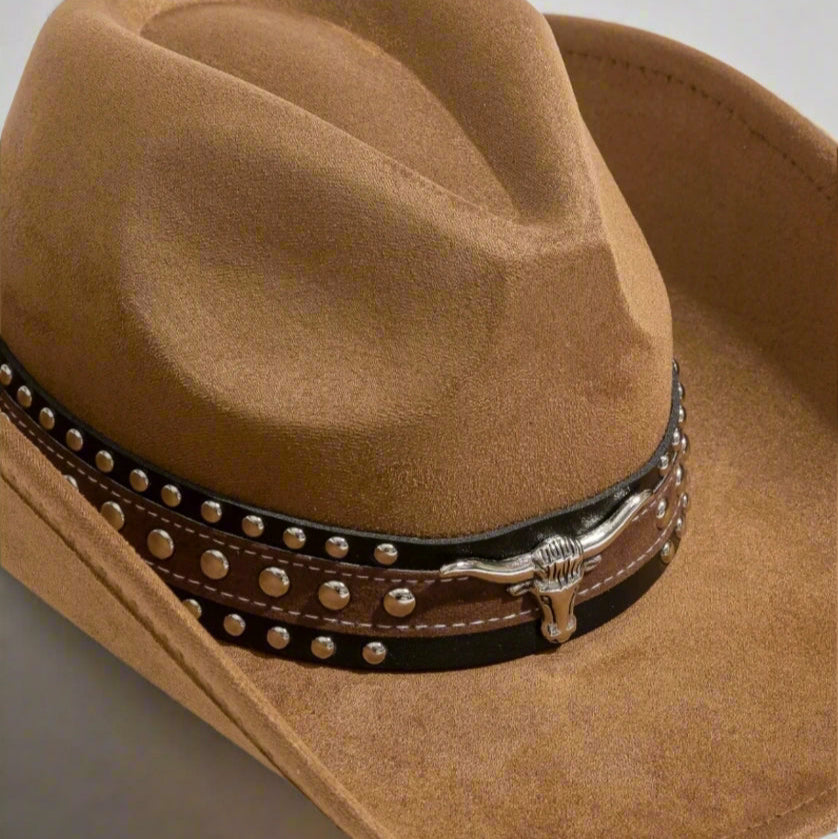 Brown cowboy hat with a studded leather band on a light gray background