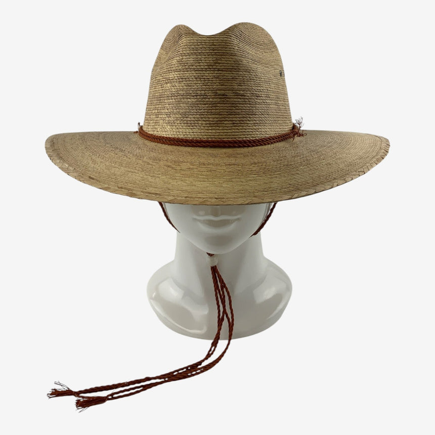 Wide-Brim Palm Straw Cowboy Hat with Braided Chin Cord, front view on mannequin head with rust cord and slide bead