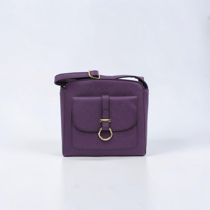 Saffiano Vegan Leather Crossbody in purple, front view with gold ring flap pocket and strap draped over the top
