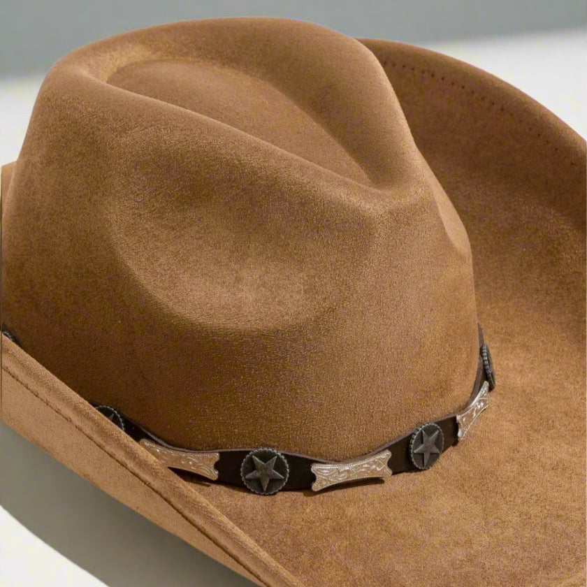 Brown cowboy hat with decorative band on a white background