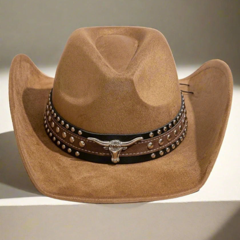 Brown cowboy hat with a studded leather band on a neutral background