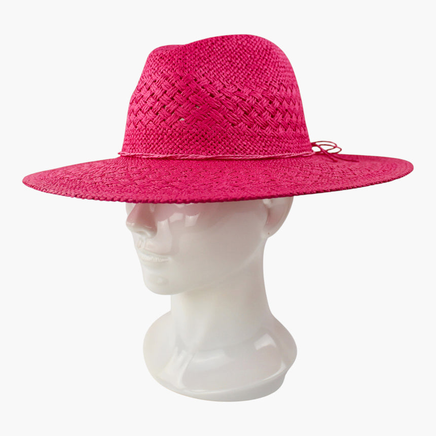 Cord-Bow Straw Fedora hat, Fuchsia colorway at a three-quarter angle showing the cord knot tucked against the crown base