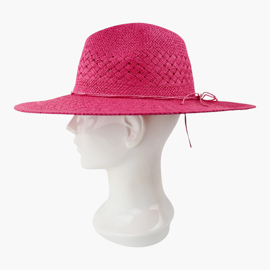 Cord-Bow Straw Fedora hat, Fuchsia colorway in profile showing the single long cord tail dropping below the brim edge