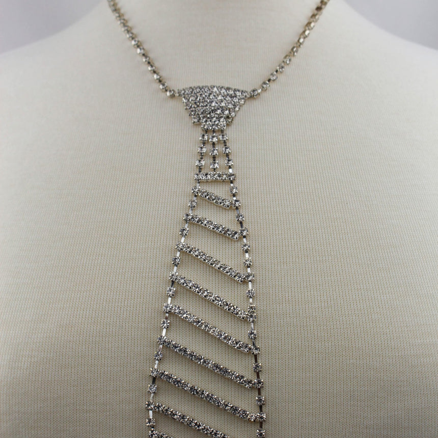 Rhinestone Necktie Necklace — Silver-Tone Alloy, Clear Crystals, pave knot and striped tie worn on a mannequin