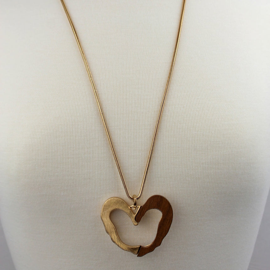 Two-Tone Open Heart Necklace — Wood & Alloy, 2 Colors, full-length view of the gold colorway on a mannequin