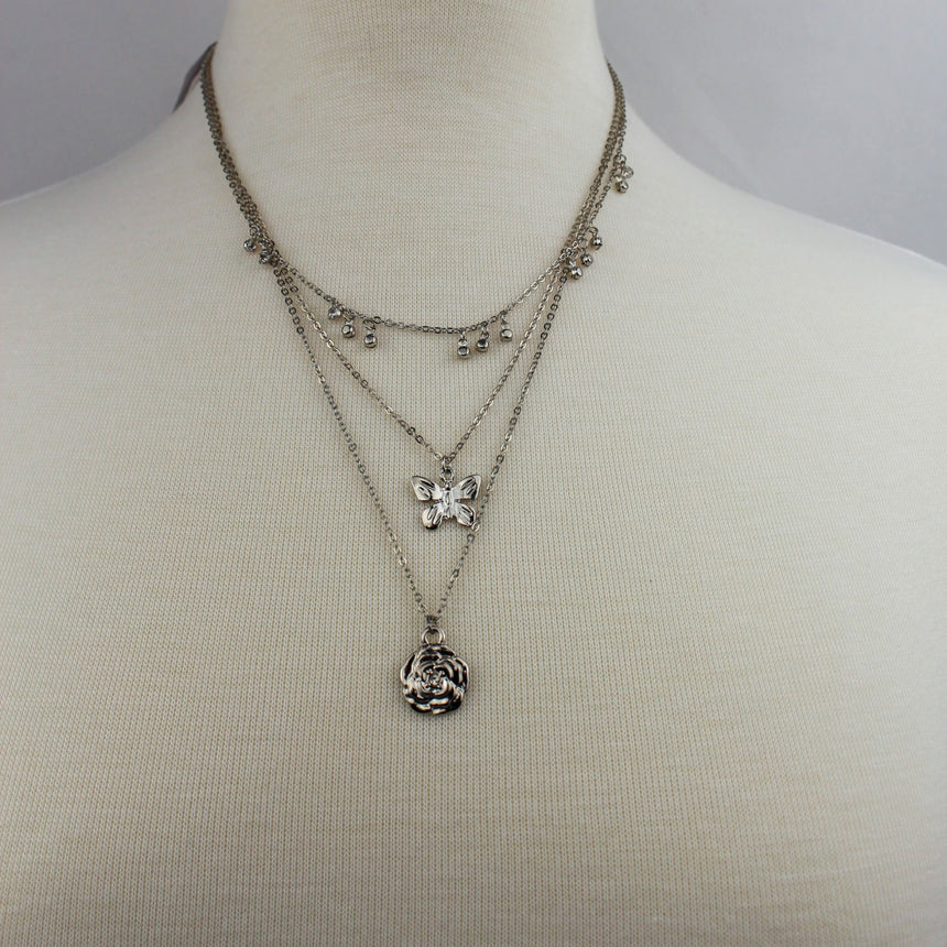 Triple Layer Butterfly Necklace — Gold-Tone or Silver-Tone Alloy, silver finish worn on a mannequin, all three layers