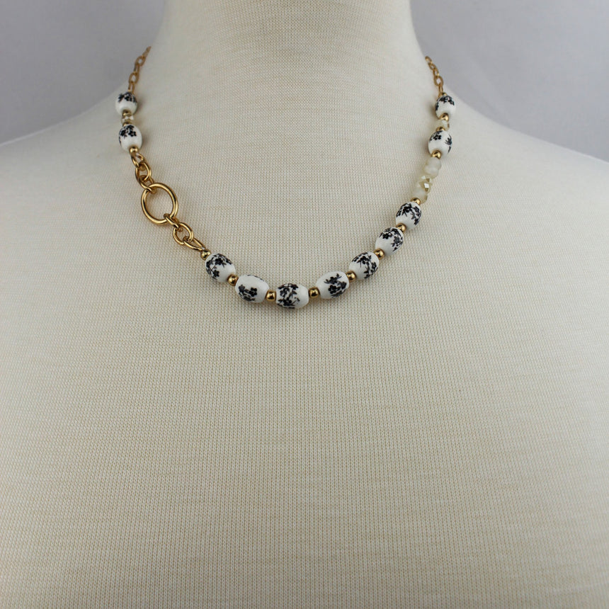 Porcelain Bead Necklace — Floral Print, Gold-Tone Ring, full necklace on mannequin