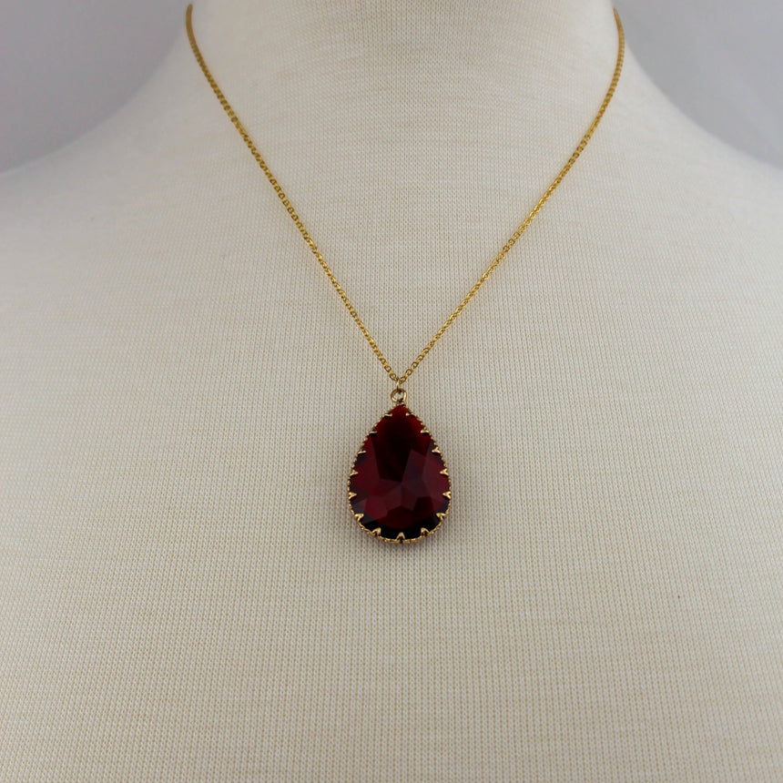 Deep Red Teardrop Necklace — Glass Crystal, Gold-Tone Chain, full pendant necklace on mannequin