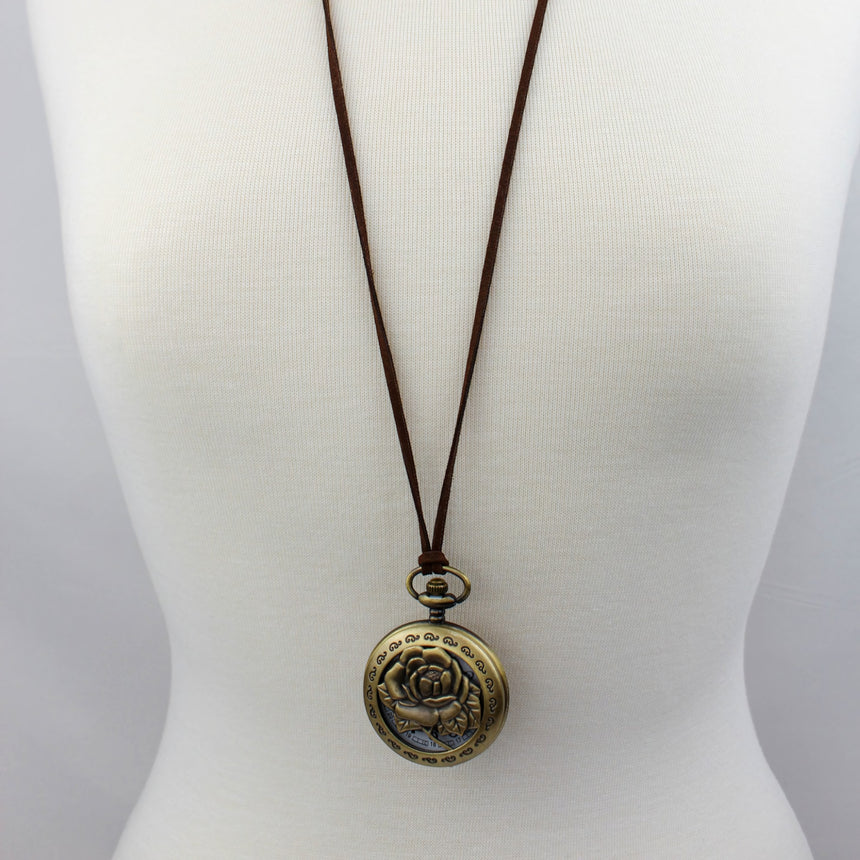 Pocket Watch Necklace — Bronze-Tone Alloy, Faux-Suede Cord, rose cover worn on suede cord, mannequin view
