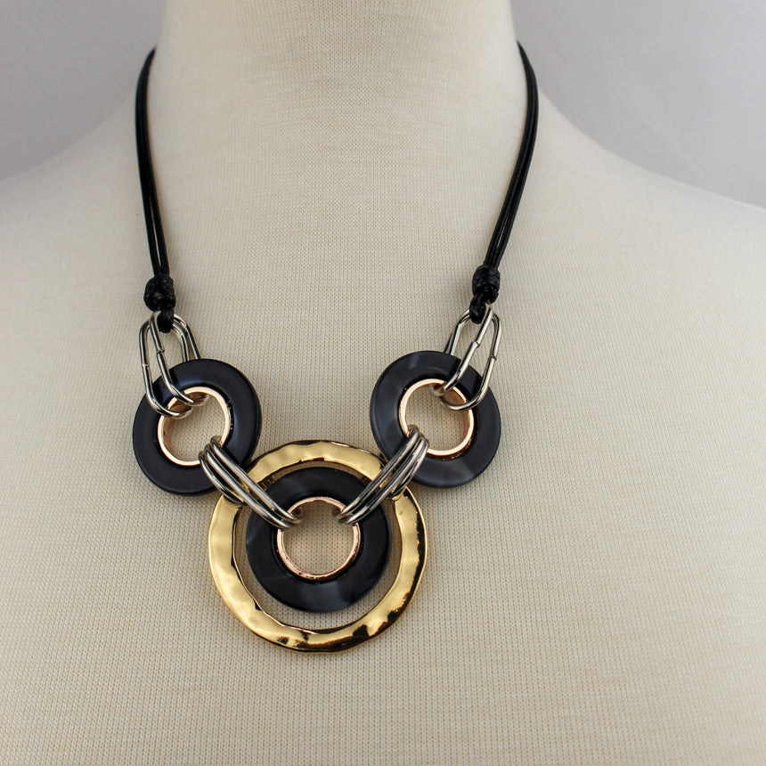 Interlocking Rings Necklace — Mixed-Tone Alloy, Black Cord, front view showing knotted black cords