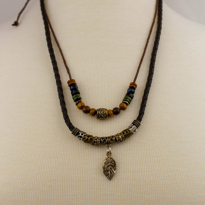 Double-Strand Cord Necklace — Beaded, Silver-Tone Leaf Charm, full view of both cord strands on mannequin