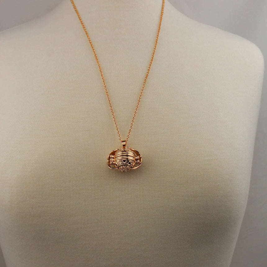 Expanding Photo Ball Locket — Gunmetal or Rose Gold Tone Alloy, rose gold finish closed, worn on a mannequin