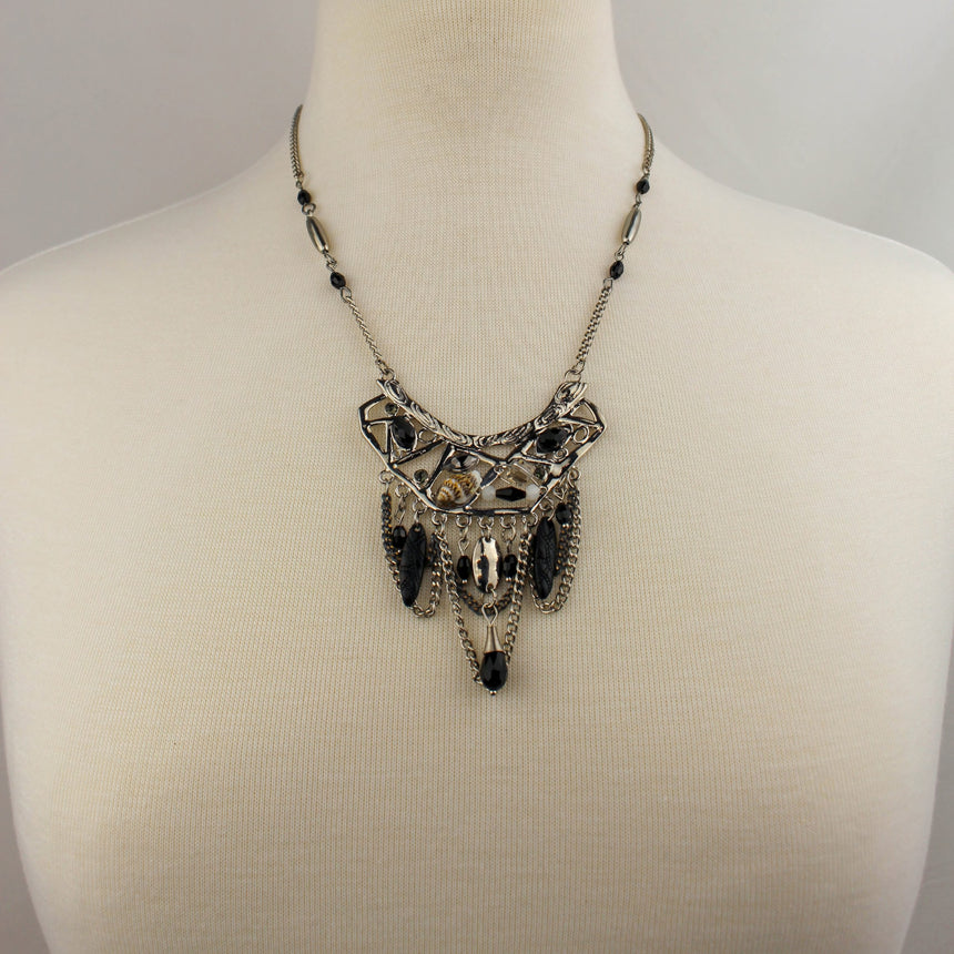 Antiqued Boho Bib Necklace — Silver-Tone Alloy, Bead Drops, front view of the bib on a mannequin