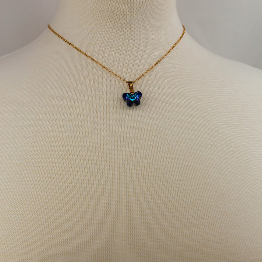 Crystal Butterfly Pendant Necklace — Glass, Four Colorways, Bermuda Blue colorway, necklace on mannequin