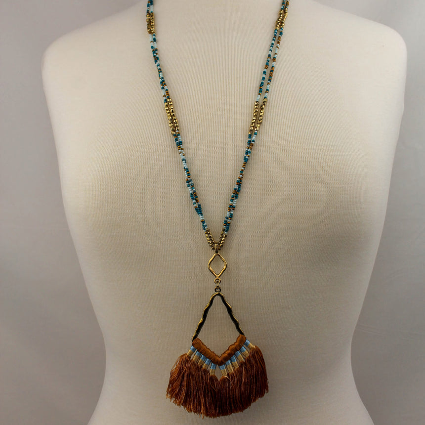 Boho Seed Bead Necklace — Rust Tassel Fringe, Antiqued Alloy, full-length view on a mannequin