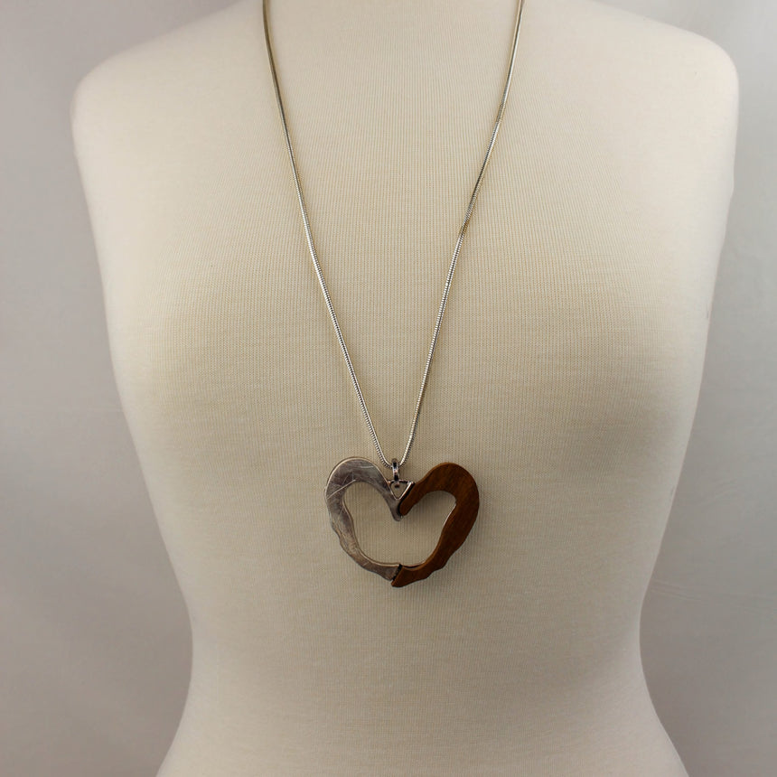 Two-Tone Open Heart Necklace — Wood & Alloy, 2 Colors, full-length view of the silver colorway on a mannequin