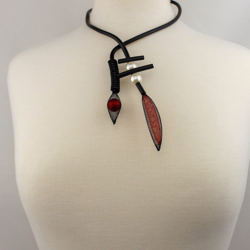 Modernist Mesh Pod Choker — Black Cord, Faux Pearls, full view of the crossover choker on a mannequin