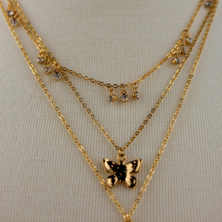 Triple Layer Butterfly Necklace — Gold-Tone or Silver-Tone Alloy, gold finish detail of the crystal drop choker