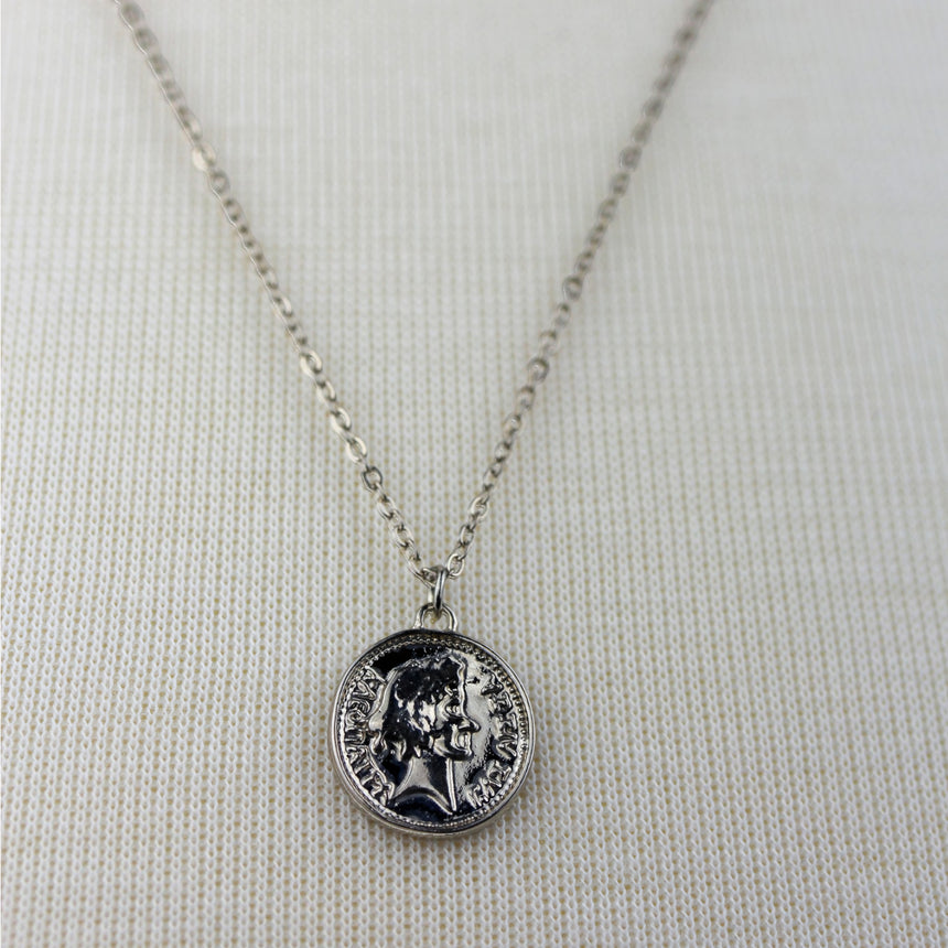 Coin Medallion Necklace — Silver-Tone Alloy, Layered Chains, close-up of the embossed coin medallion