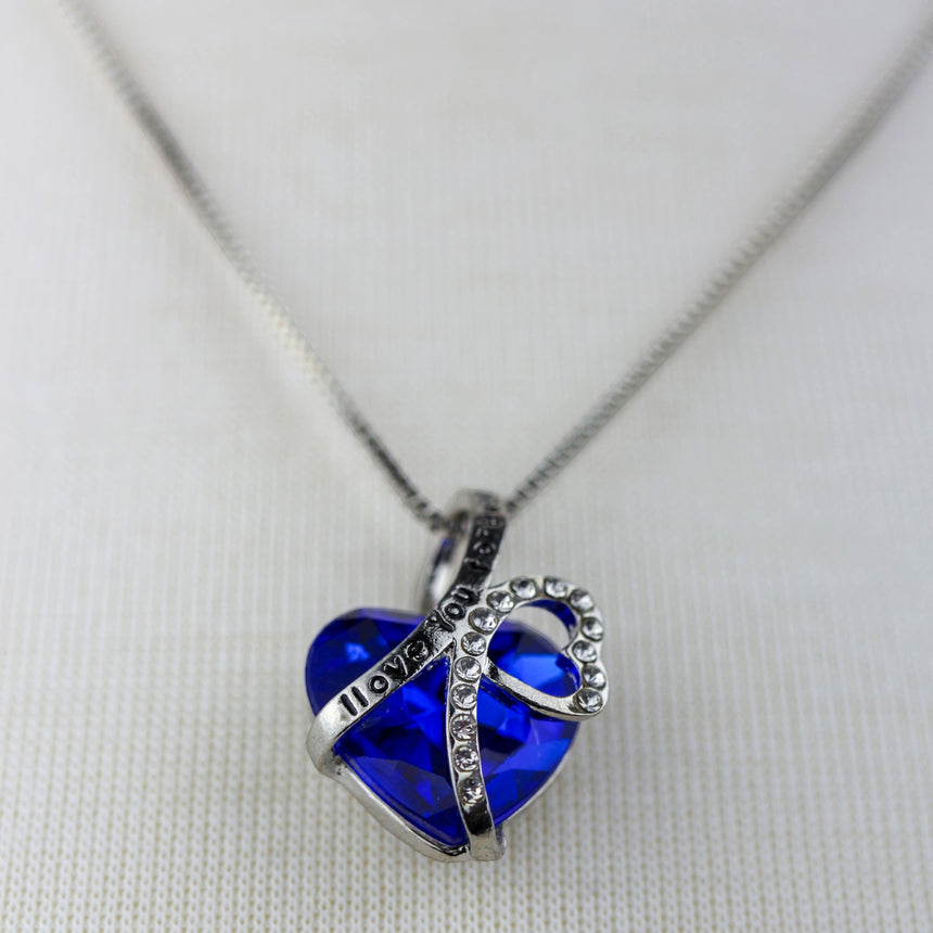 Blue Crystal Heart Necklace — I Love You Ribbon, Silver-Tone, close-up of the heart and rhinestone ribbon