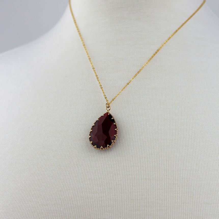 Deep Red Teardrop Necklace — Glass Crystal, Gold-Tone Chain, close-up of the red crystal teardrop pendant