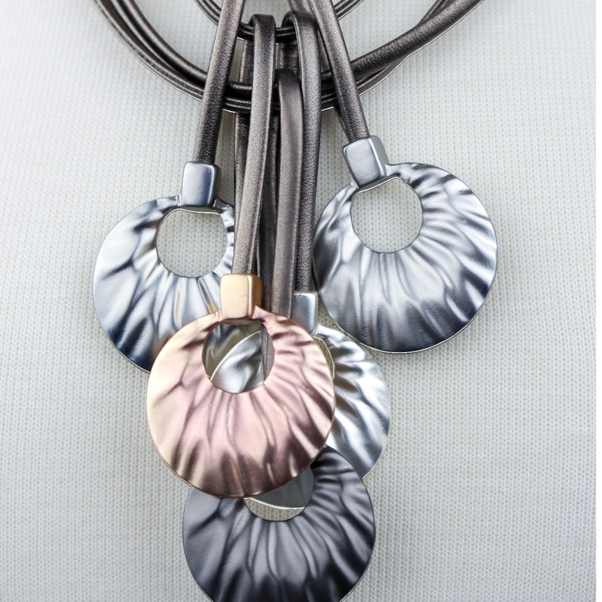 Multi-Cord Statement Necklace — Textured Discs, Mixed Tones, close-up of disc texture and silver-tone caps