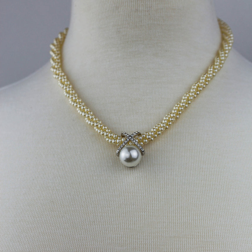 Twisted Pearl Torsade Choker — Faux Seed Pearls, Crystal X Motif, worn on a mannequin with the center pearl