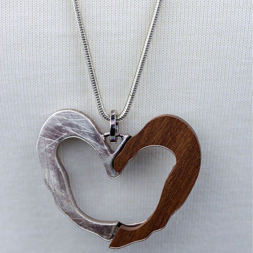 Two-Tone Open Heart Necklace — Wood & Alloy, 2 Colors, close-up of the silver and wood heart pendant