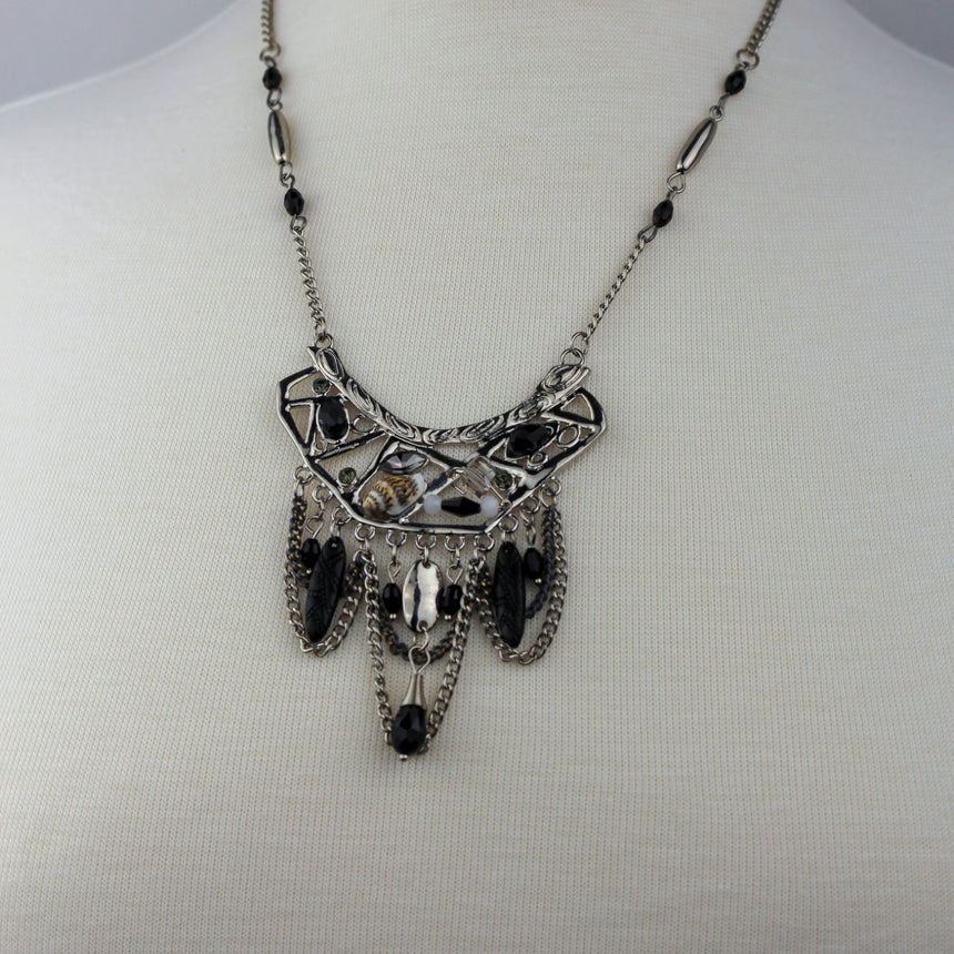Antiqued Boho Bib Necklace — Silver-Tone Alloy, Bead Drops, full view of the necklace on a mannequin