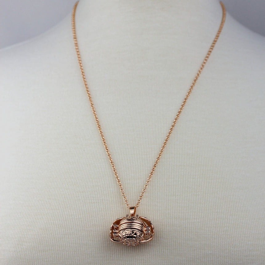 Expanding Photo Ball Locket — Gunmetal or Rose Gold Tone Alloy, rose gold finish closed pendant front view