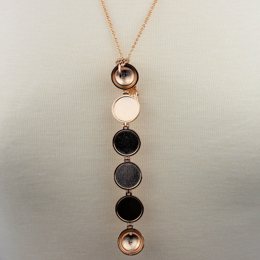 Expanding Photo Ball Locket — Gunmetal or Rose Gold Tone Alloy, rose gold finish open frames against the neckline