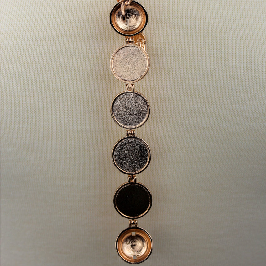 Expanding Photo Ball Locket — Gunmetal or Rose Gold Tone Alloy, rose gold finish close-up of the open photo frames