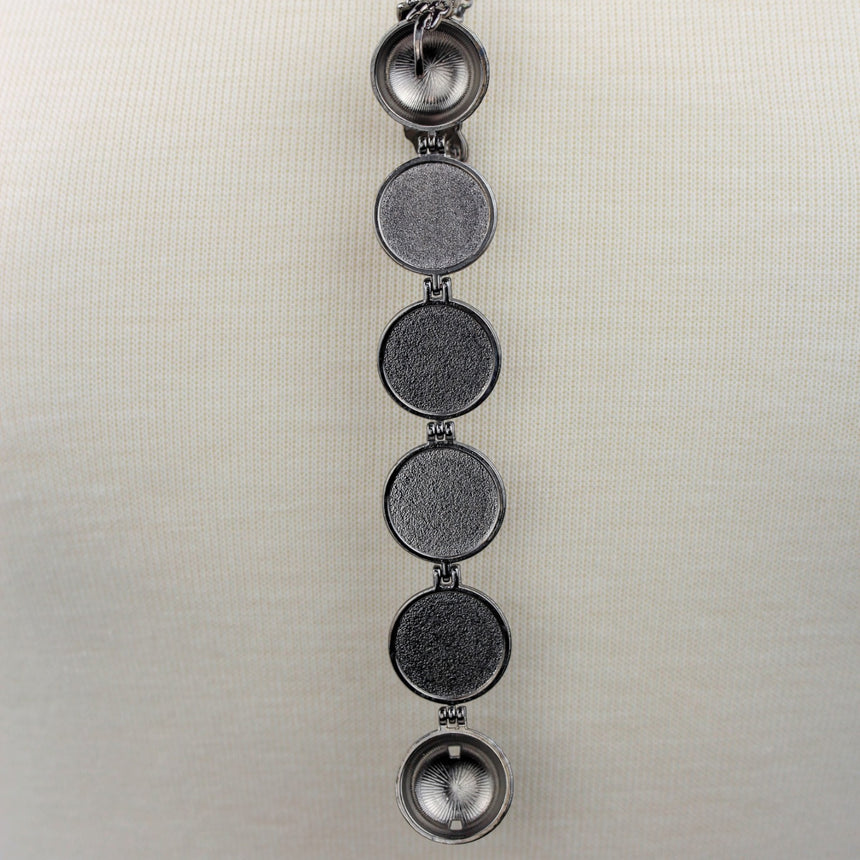 Expanding Photo Ball Locket — Gunmetal or Rose Gold Tone Alloy, gunmetal finish close-up of the empty photo frames