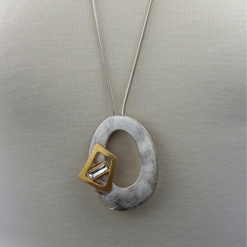 Organic Oval Pendant Necklace — Silver-Tone Chain, Crystal, mid view of the pendant on the long snake chain
