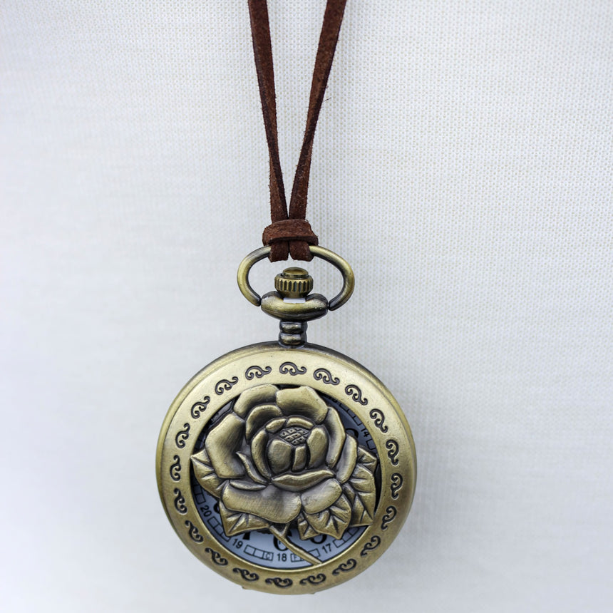 Pocket Watch Necklace — Bronze-Tone Alloy, Faux-Suede Cord, close-up of the rose cutout cover
