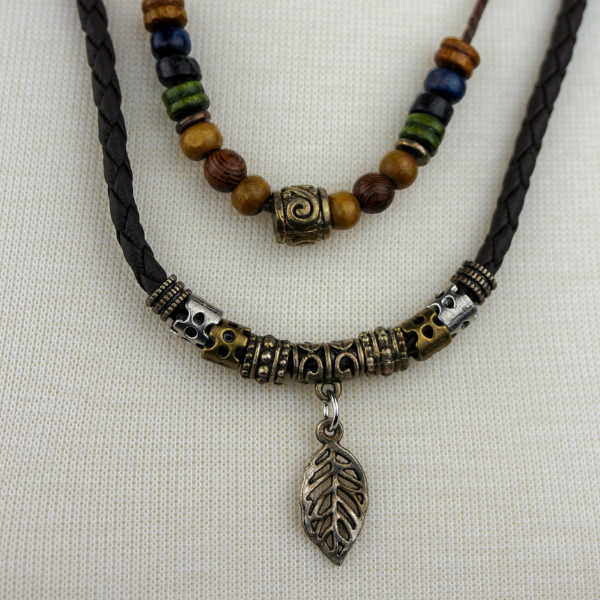 Double-Strand Cord Necklace — Beaded, Silver-Tone Leaf Charm, close-up of beads and silver-tone leaf charm