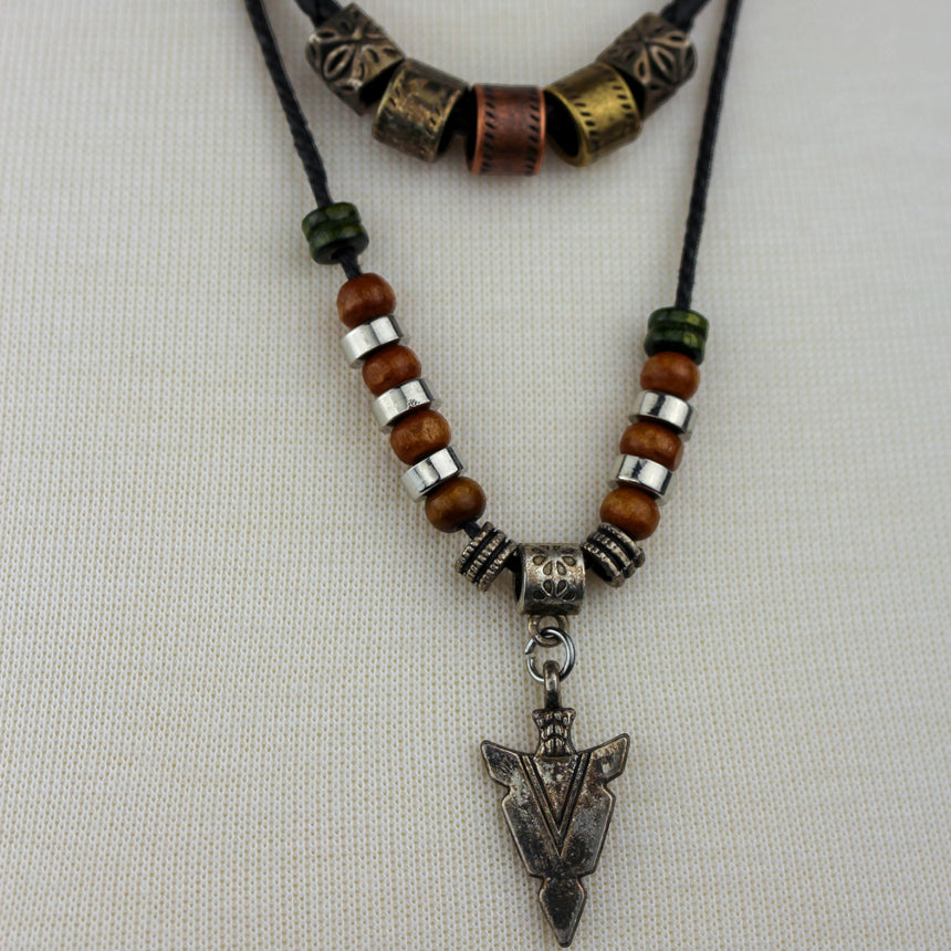 Arrowhead Double Cord Necklace — Wood Beads, Adjustable Cords, close-up of etched barrel beads and arrowhead