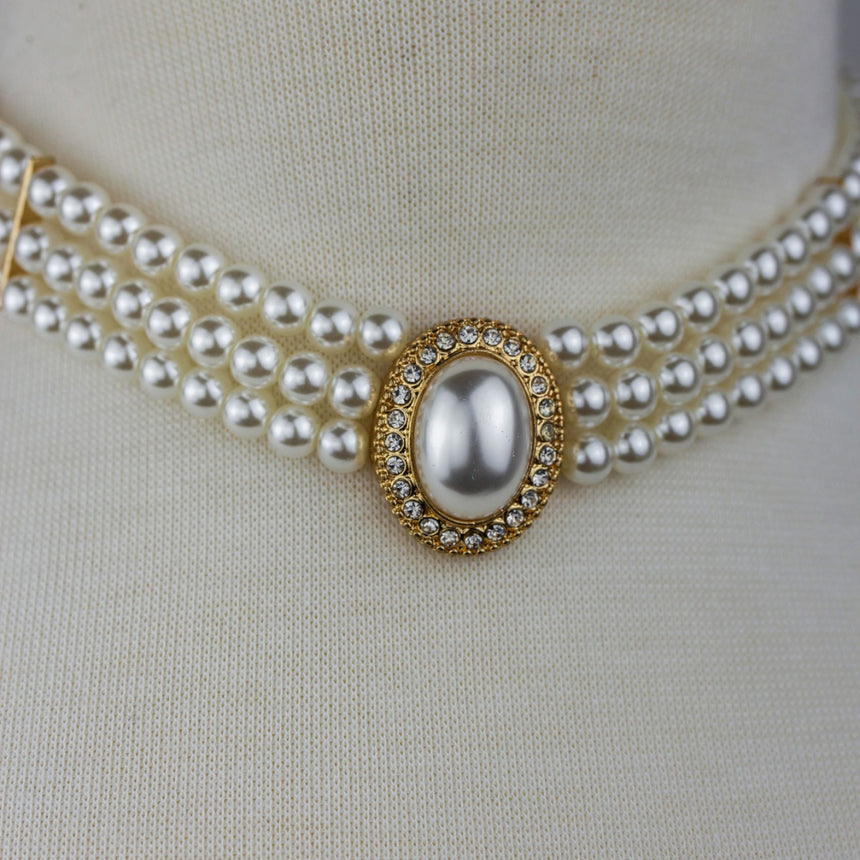 Three-Strand Pearl Choker — Faux Pearls, Rhinestone Halo, tight close-up of the oval center in its rhinestone halo