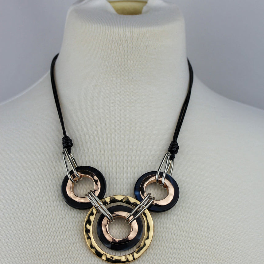 Interlocking Rings Necklace — Mixed-Tone Alloy, Black Cord, view of the cords and knots above the rings