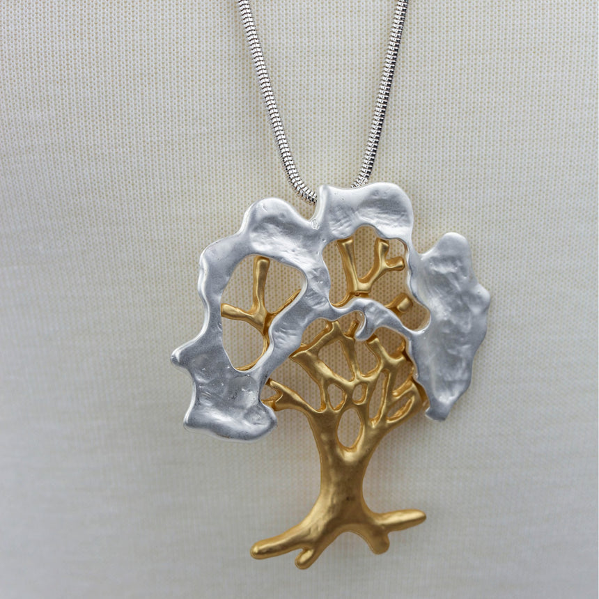 Two-Tone Tree Pendant — Matte Gold and Silver-Tone Alloy, close-up of the gold tree over the silver canopy