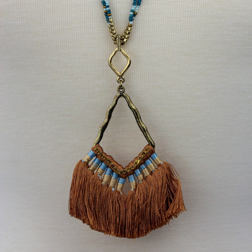 Boho Seed Bead Necklace — Rust Tassel Fringe, Antiqued Alloy, mid view showing pendant and bead strands