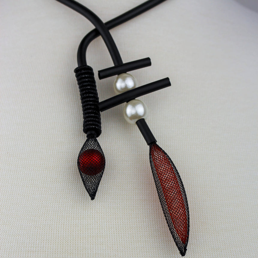 Modernist Mesh Pod Choker — Black Cord, Faux Pearls, tighter close-up of the coil wrap and red bead pod