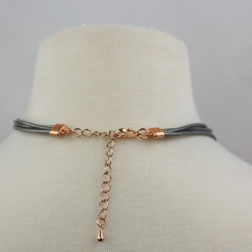Three-Layer Pebble Necklace — Mixed-Tone Alloy, Gray Cords, back view of the rose-gold-tone clasp and extender chain