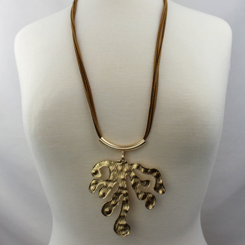 Hammered Leaf Necklace — Gold-Tone Alloy, Faux-Suede Cords, full view showing the ridged texture side of the pendant