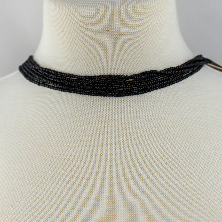 Black Fringe Y-Necklace — Seed Beads, Crystal Medallion, close-up of the beaded strands at the collar