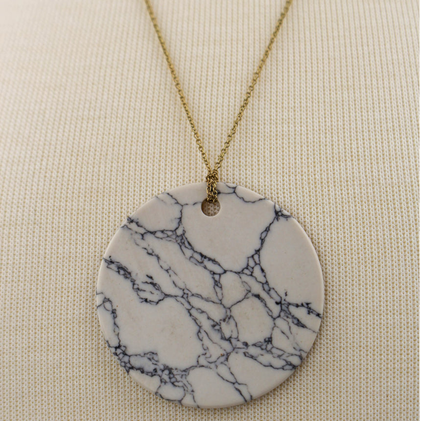 Marble Look Disc Pendant — Printed Cross Reverse, Gold-Tone Chain, close-up of the gray veined marble face