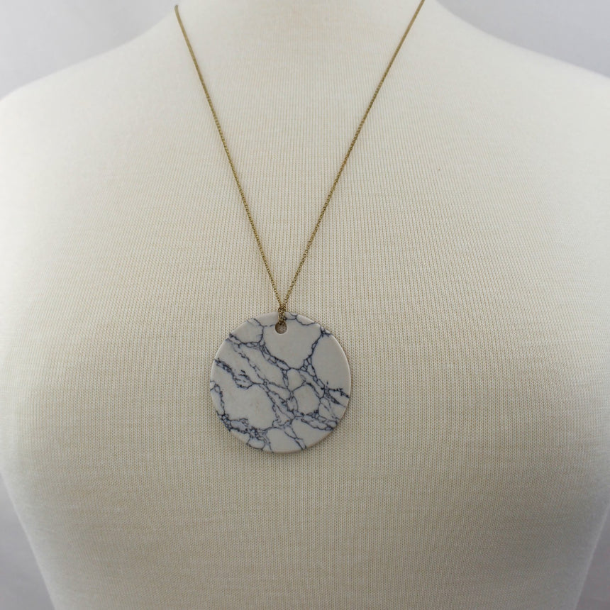 Marble Look Disc Pendant — Printed Cross Reverse, Gold-Tone Chain, plain marble face worn on a mannequin