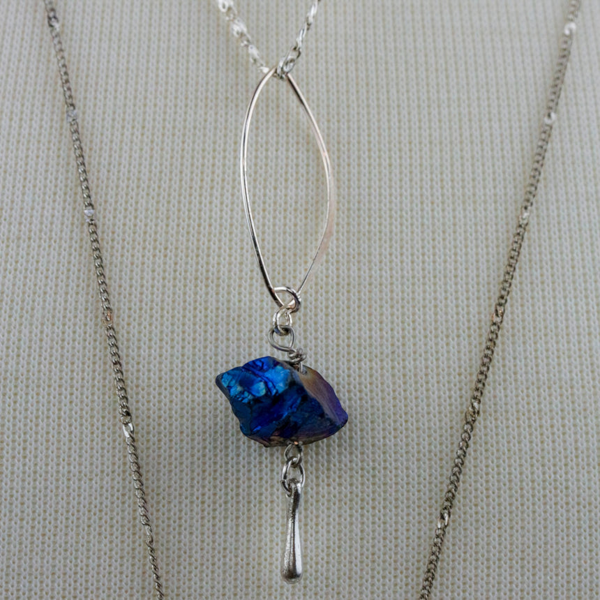 Blue Nugget Necklace Set — Silver-Tone Chains, Faceted Point, close-up of the marquise frame and wire-wrapped nugget