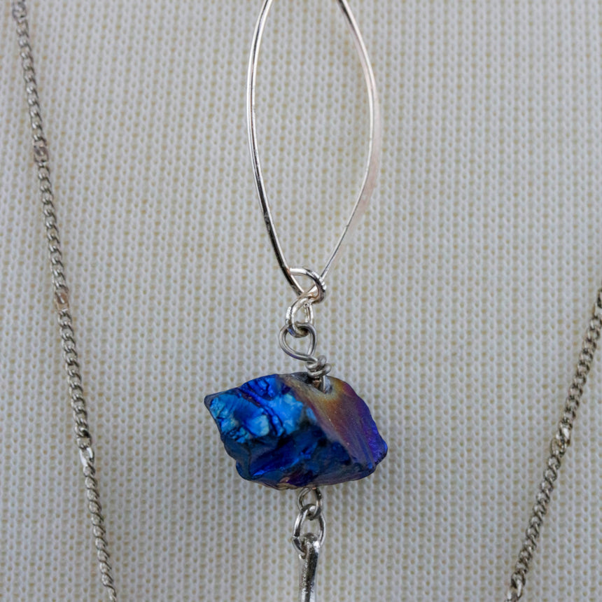 Blue Nugget Necklace Set — Silver-Tone Chains, Faceted Point, detail of the iridescent blue nugget