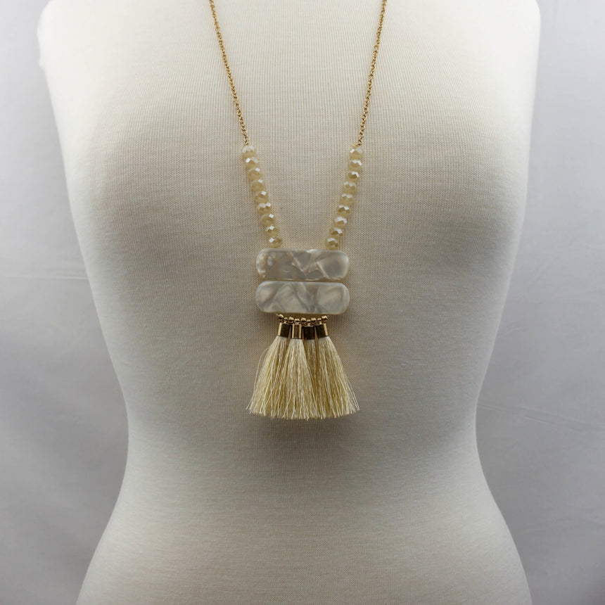 Champagne Tassel Fan Necklace — Glass Crystal Beads, Silk Tassels, worn full length on a mannequin